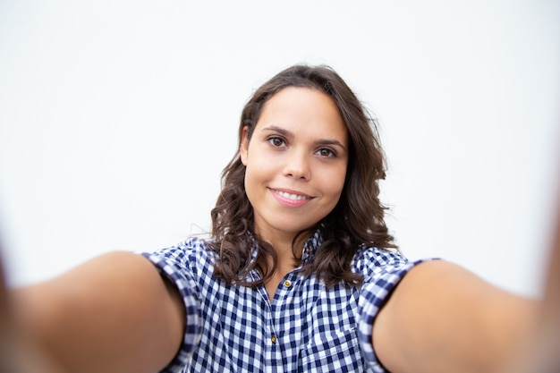 Free Photo cheerful young woman taking selfie