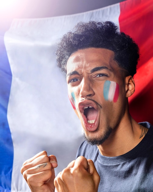 Free photo cheering man with french flag