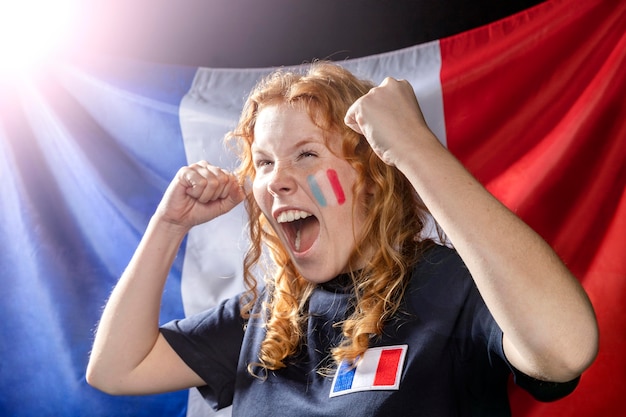 Free photo cheering woman with french flag