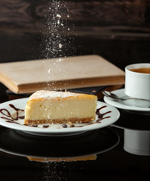 Cheese cake with tea on the table