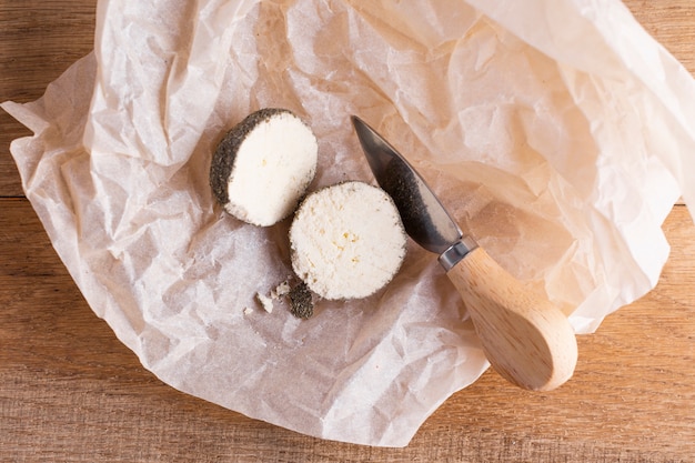 Cheese cut in half on table