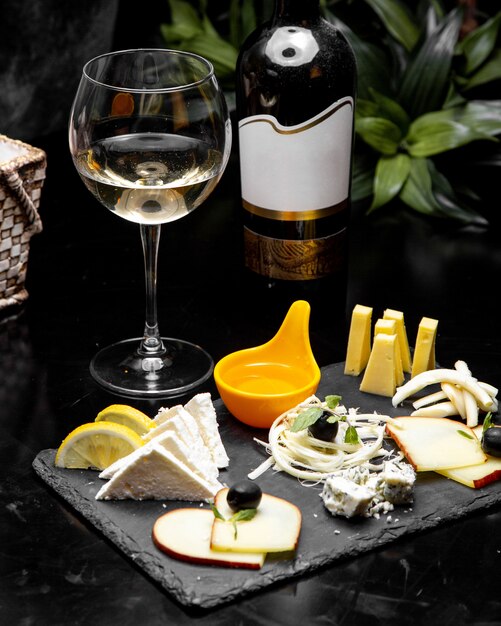 Cheese plate  with white wine  side view