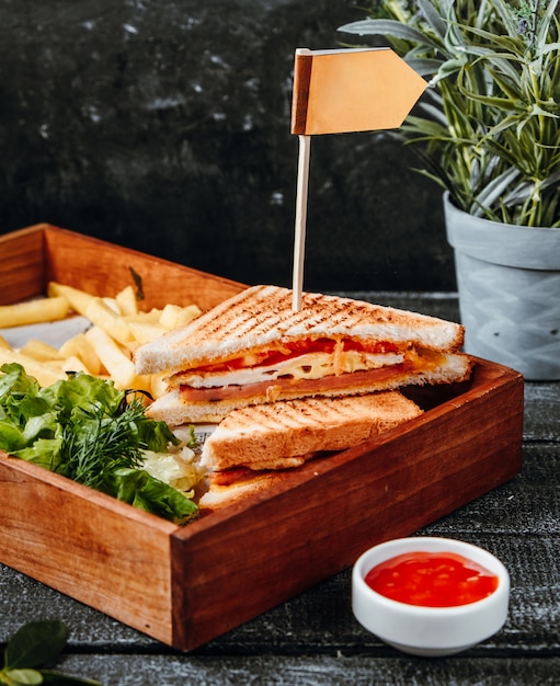 Free photo cheese sandwich with french fries on wooden board