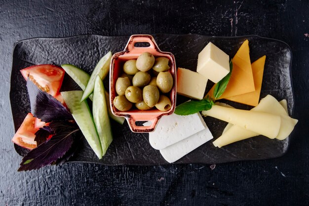 Cheese set olive tomato cucumber top view