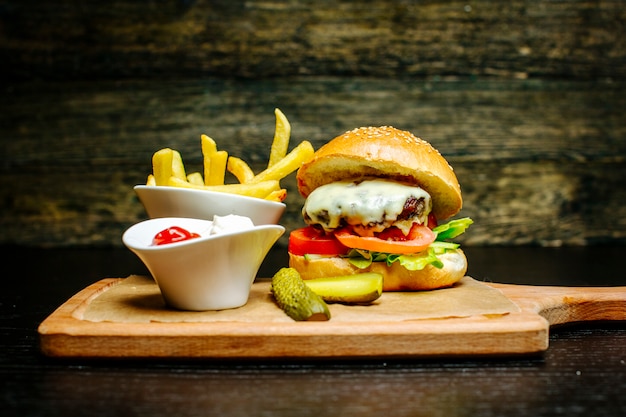 Cheeseburger with pickles and fries