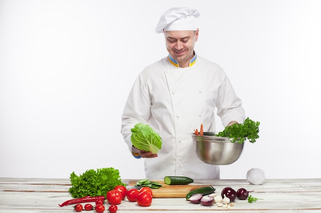 Free Photo chef cooking fresh vegetable salad in his kitchen