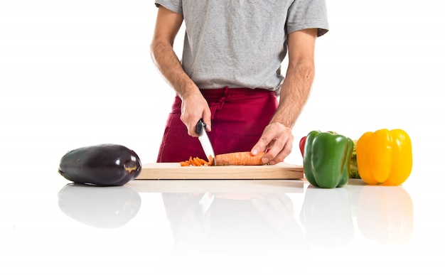 Free Photo chef cutting a carrot