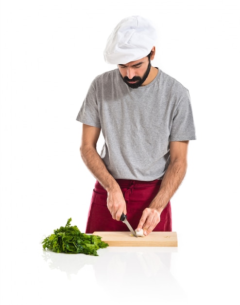 Free photo chef cutting a garlic