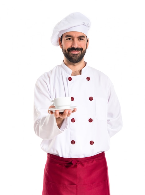 Chef holding a cup of coffee over white background