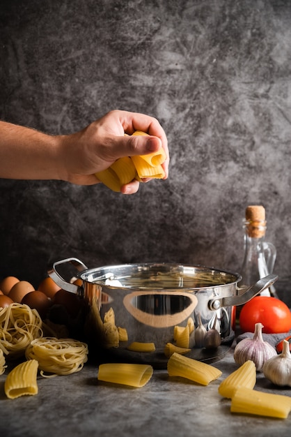 Chef holding large shaped pasta