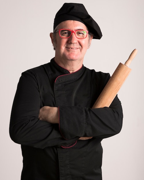 Free photo chef holding rolling pin