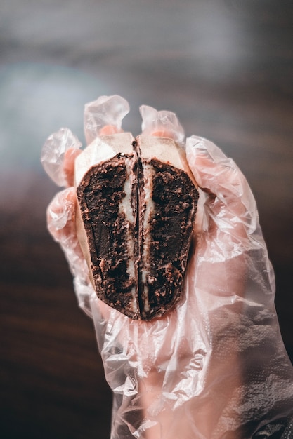 Free Photo chef holding the sliced chocolate cake