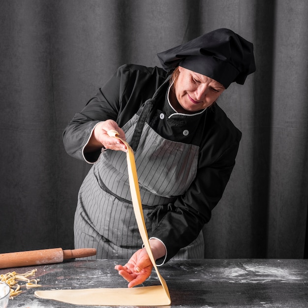 Free photo chef making dough sheet