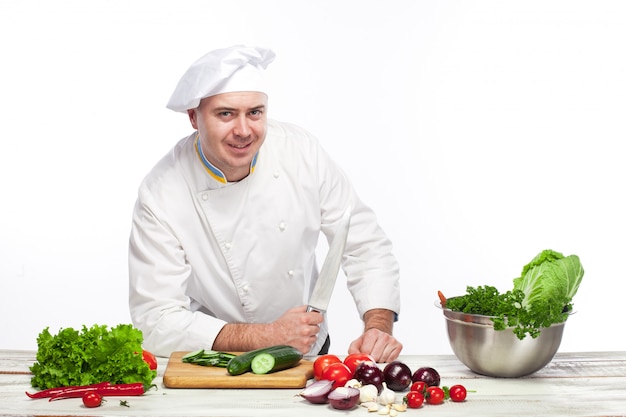 Chef posing with knife in his kitchen