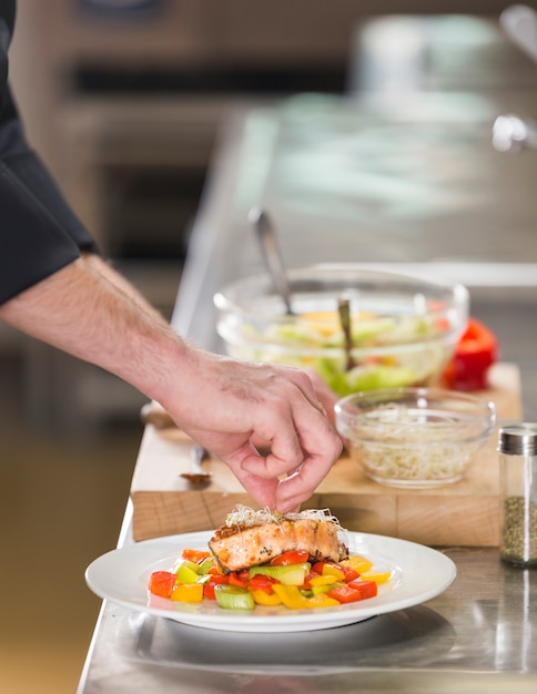 Free Photo chef preparing a dish of healthy food