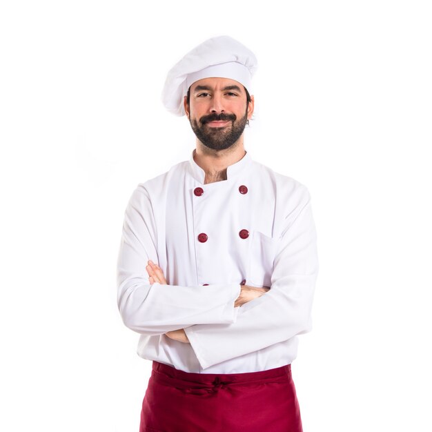 Chef with his arms crossed over white background