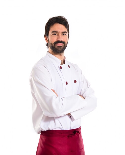 Chef with his arms crossed over white background