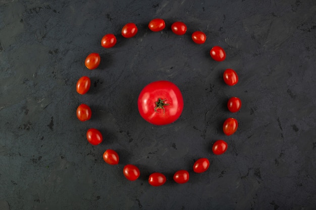 Cherry tomatoes red ripe tomatoe on grey desk