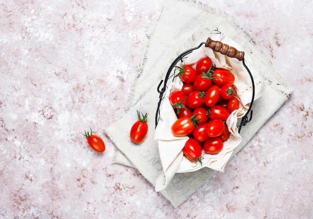 Cherry tomatoes of various colors,yellow and red cherry tomatoes on light background