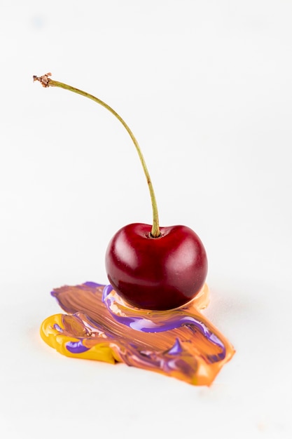 Free photo cherry with mixed orange and yellow paint