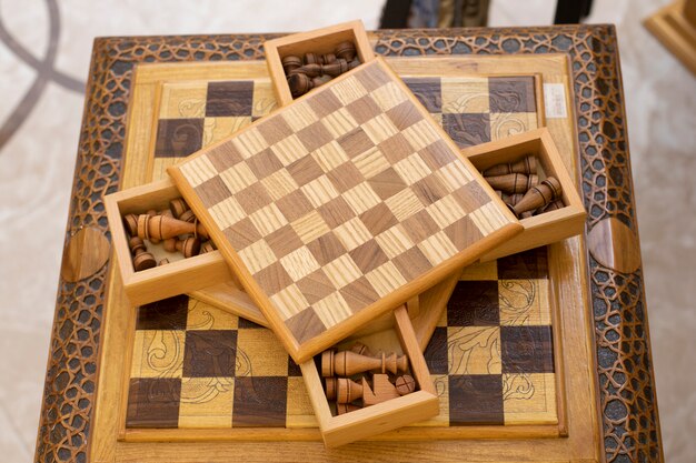 Chess board made from wood with figure drawers