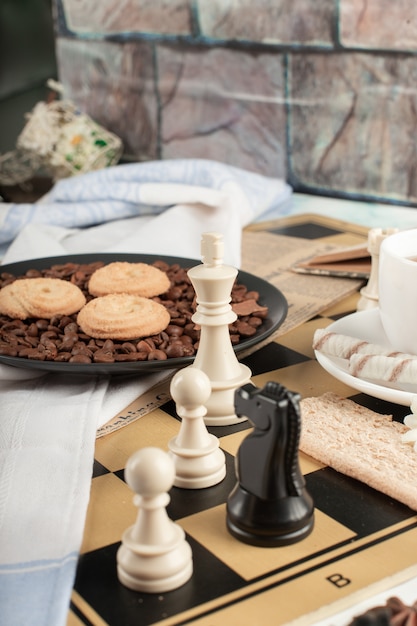 Free Photo chess figures and a cookie platter