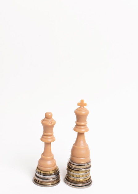 Chess pieces king and queen inequality concept front view