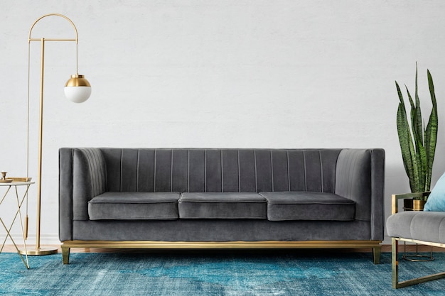 Chic mid-century modern luxury aesthetics living room with gray velvet couch and blue rug