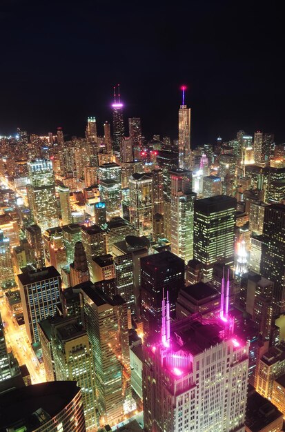 Chicago downtown aerial view at night with skyscrapers and city skyline at Michigan lakefront.