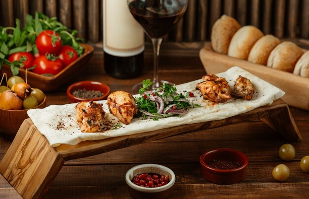 Chicken bbq served in lavash with spicy salad