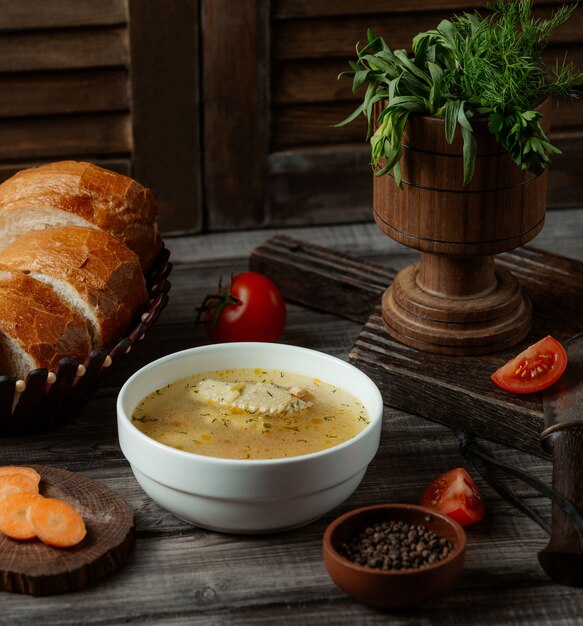 Chicken broth soup with herbs and spices