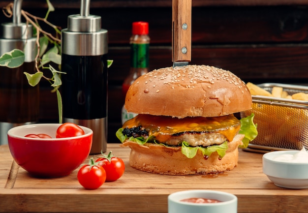 chicken burger with cheddar cheese and french fries