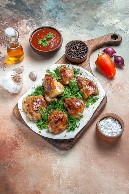 Free Photo chicken chicken with herbs on lavash sauce spices bell pepper oil garlic