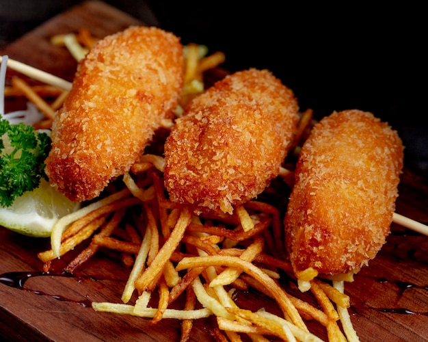 Chicken cutlets served with french fries