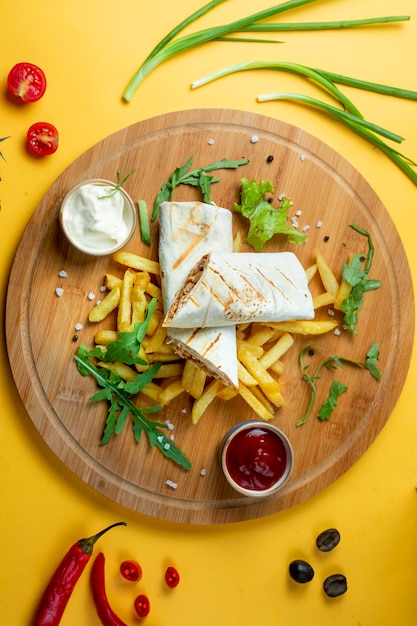 Chicken doner in lavash with fries