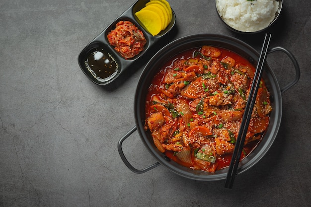 Free Photo chicken fried in hot pot with spicy sauce in korean style