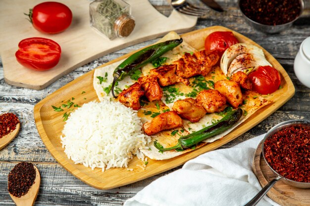 Chicken kebab  with rice  pepper  side view