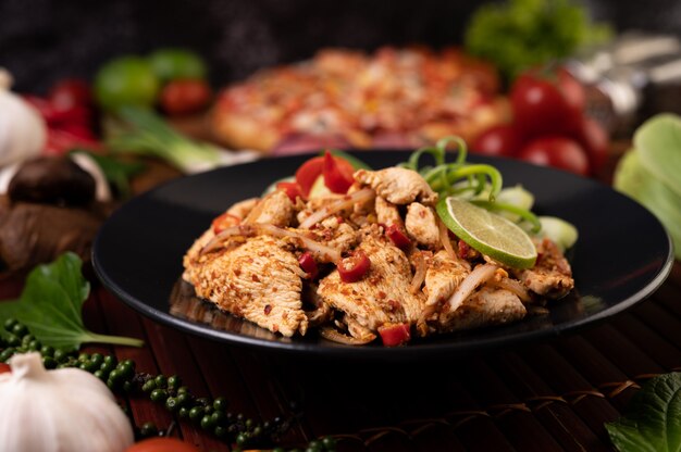 Chicken Larb on the plate With dried chilies, tomatoes, spring onions and lettuce