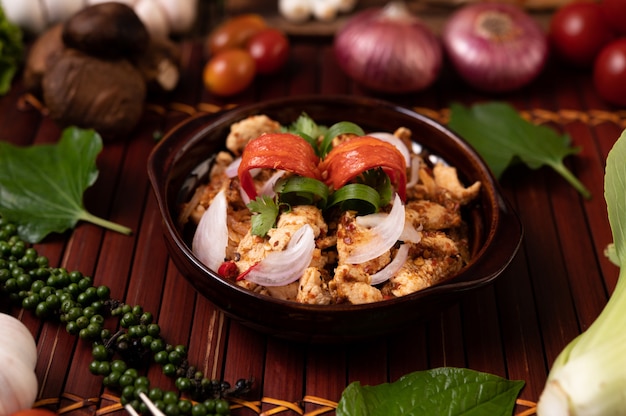 Chicken Larb on the plate With dried chilies, tomatoes, spring onions and lettuce