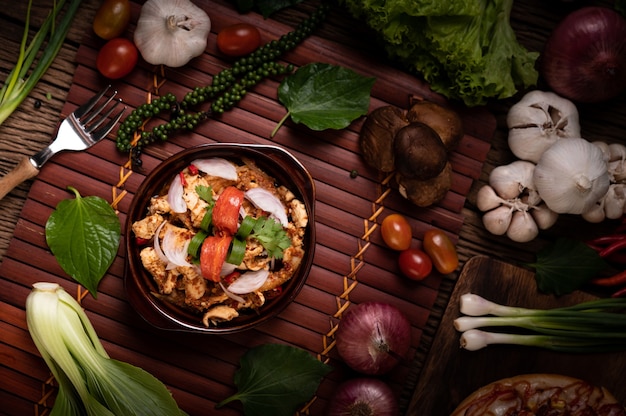 Chicken Larb on the plate With dried chilies, tomatoes, spring onions and lettuce