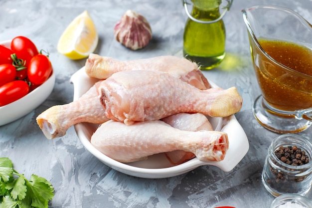 Free photo chicken legs with spices and salt ready for cooking.