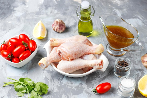 Chicken legs with spices and salt ready for cooking.