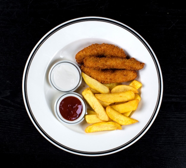 Free photo chicken nuggets and french fries