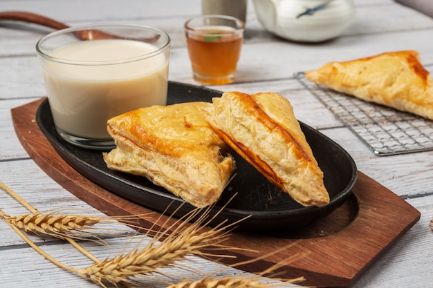 Chicken pie or kurnik that is beautifully decorated on the table.