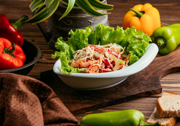 Chicken salad with bell pepper in mayonnaise on the table