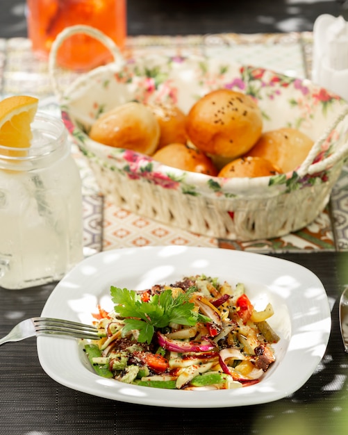 chicken salad with vegetables on the table