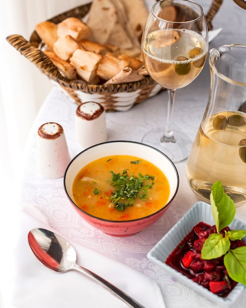 Chicken soup bowl served with feijoa kompot