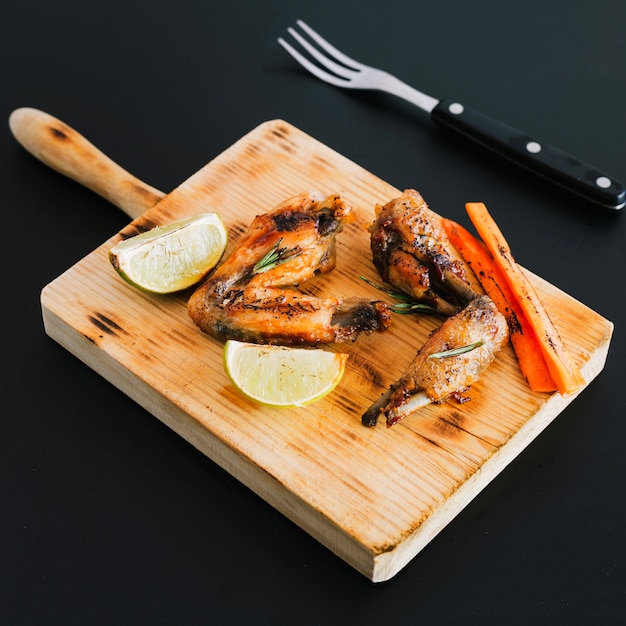 Chicken wings on cutting board