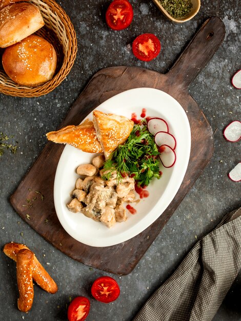 Chicken with mushrooms in cream sauce with puff bread