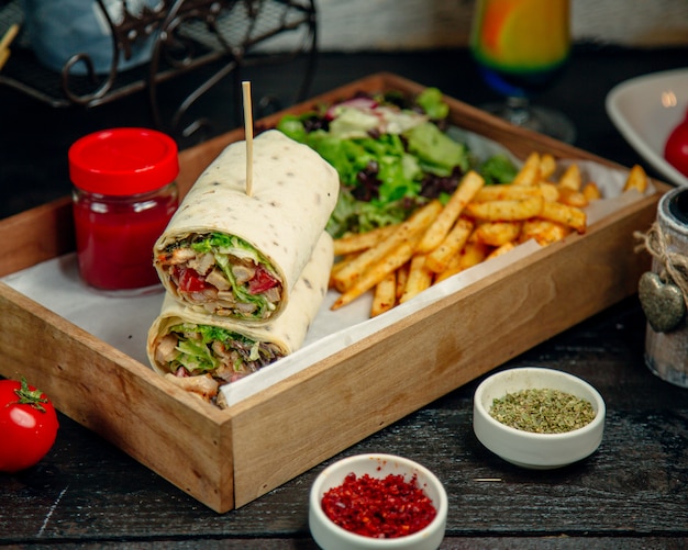 Free photo chicken wrap served with fries and salad